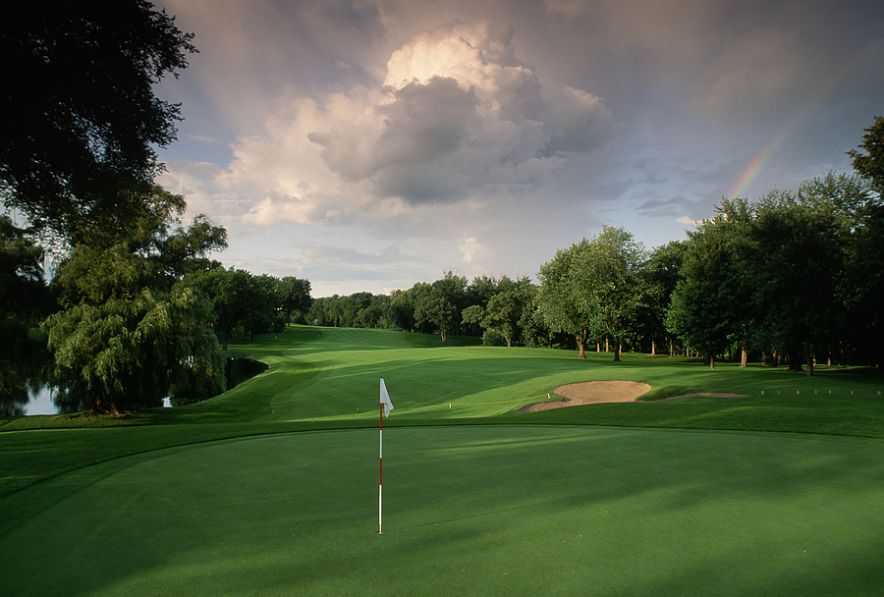 A fairway leads to a green on the golf course at the Interlachen Country Club.  Edina, Minnesota.